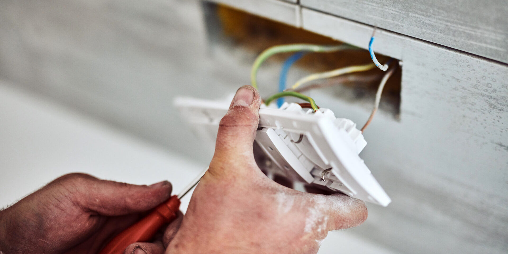 Electrician Repairing / Fixing Wires In The Wall.