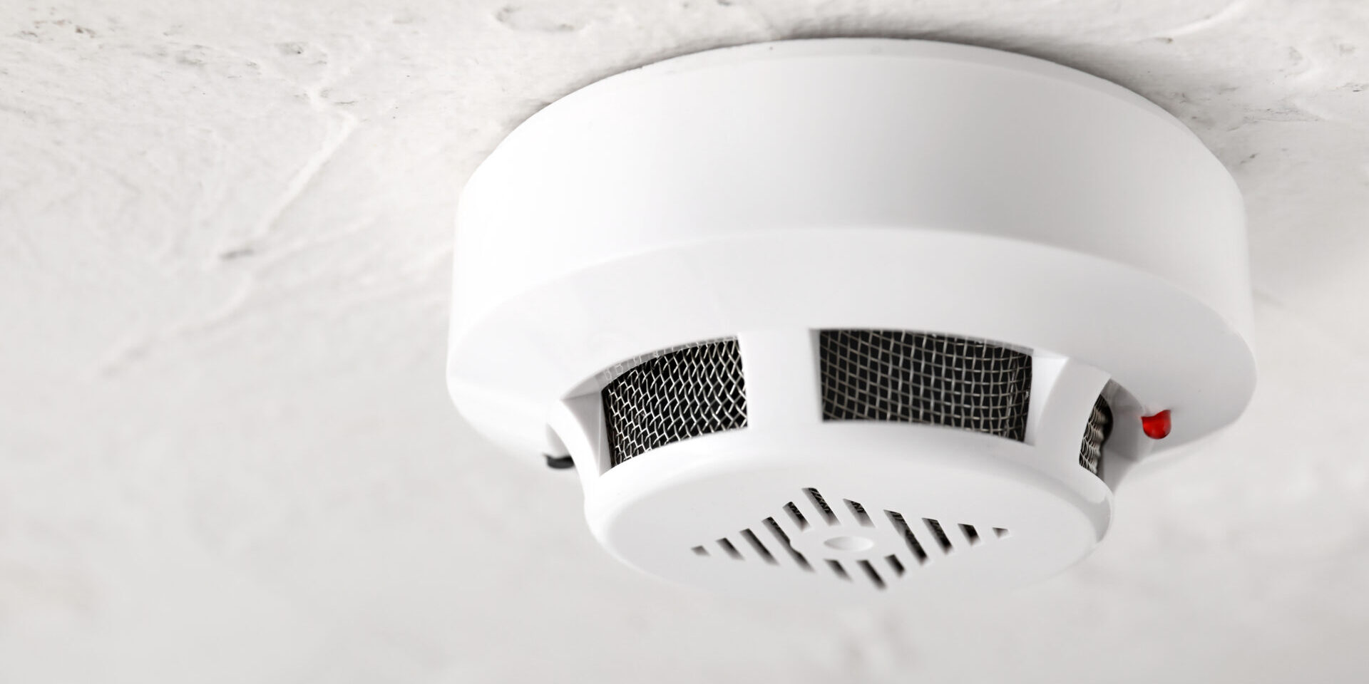 Modern Smoke Detector On Ceiling